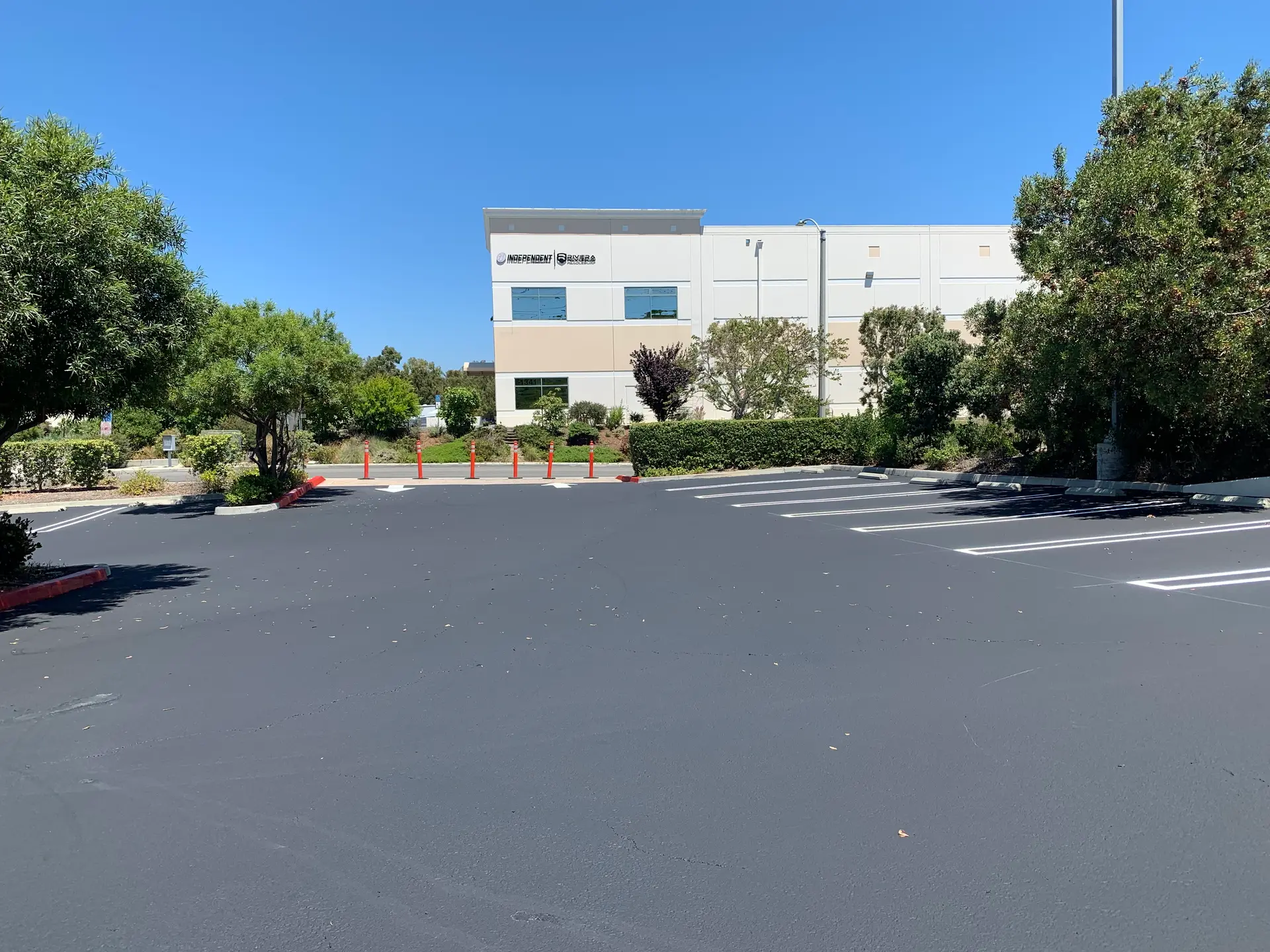 Freshly striped parking stalls by Native Union Engineering
